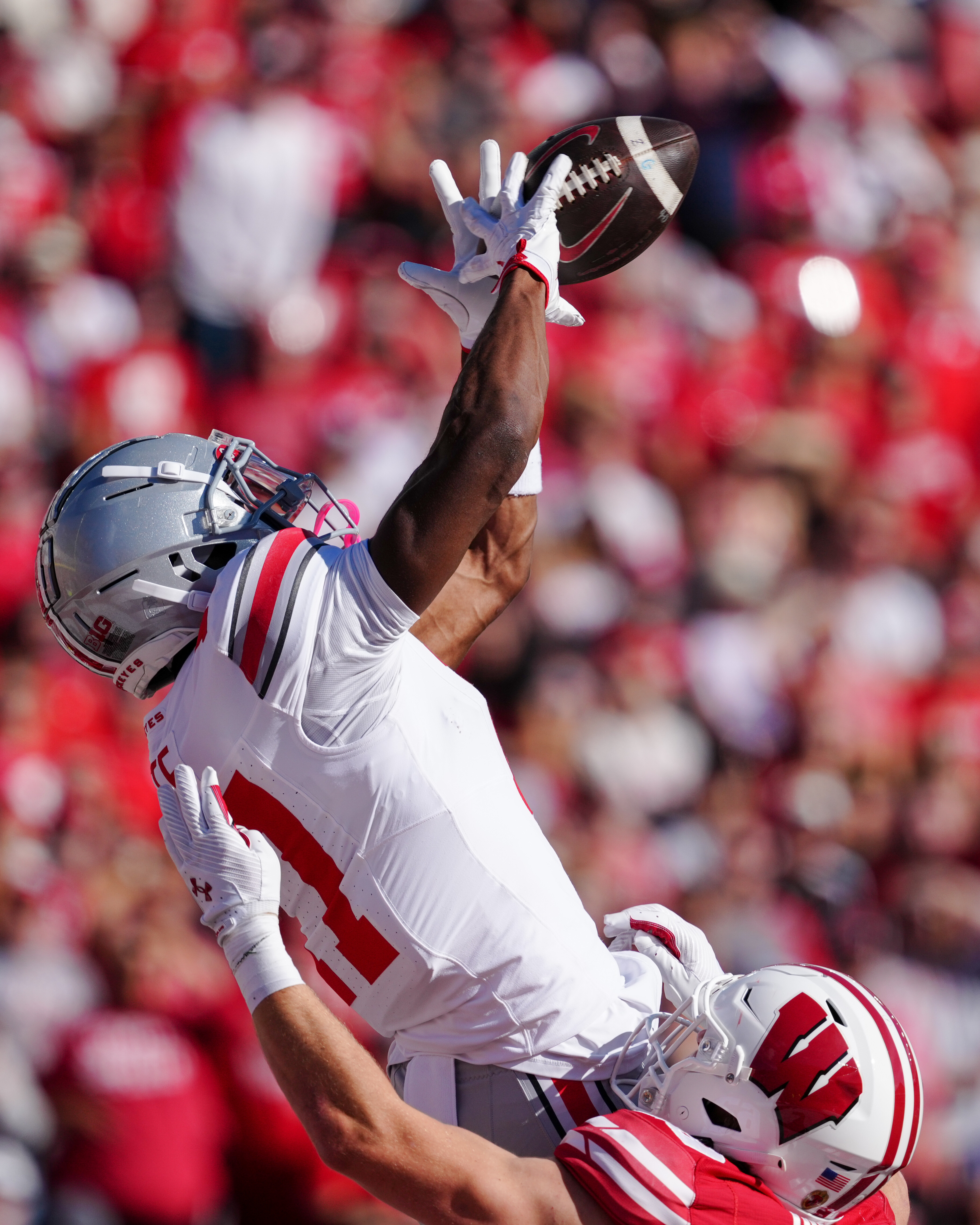 Oct 18, 2025; Madison, Wisconsin, USA; Ohio State Buckeyes wide receiver Carnell Tate (17) catches a touchdown pass in the first quarter agains the Wisconsin Badgers at Camp Randall Stadium on October 18, 2025 in Madison, Wisconsin. Photography by Ross Harried for Second Crop Sports.
